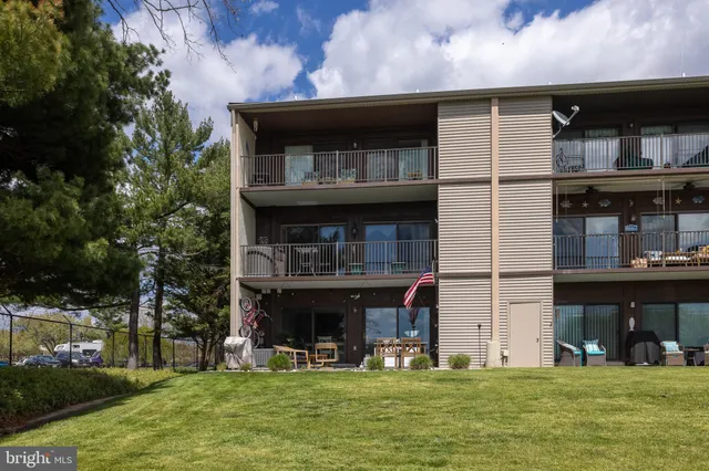 a view of a chairs and a table in the patio