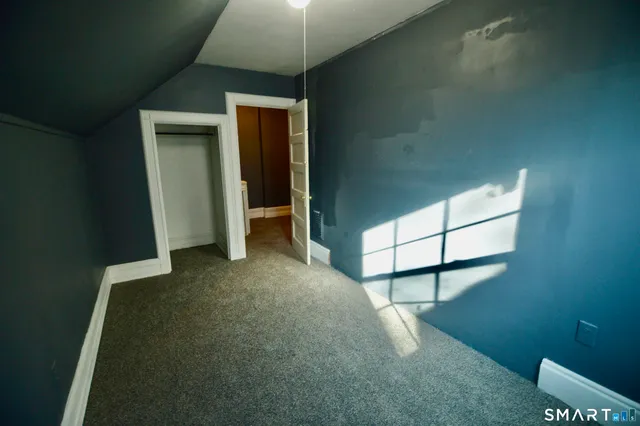 a bathroom with a toilet a sink and shower