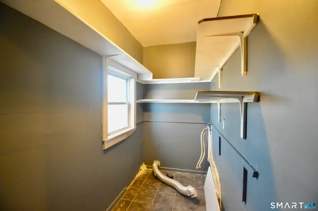 a view of a big room with windows