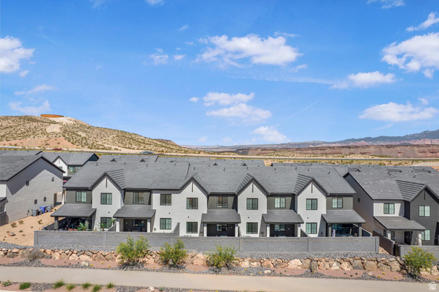 1705 Ripple Rock Drive, Unit 3017 Washington, UT 84780 - Photo 19 of 22 Modern townhome row with a consistent gray and white exterior palette