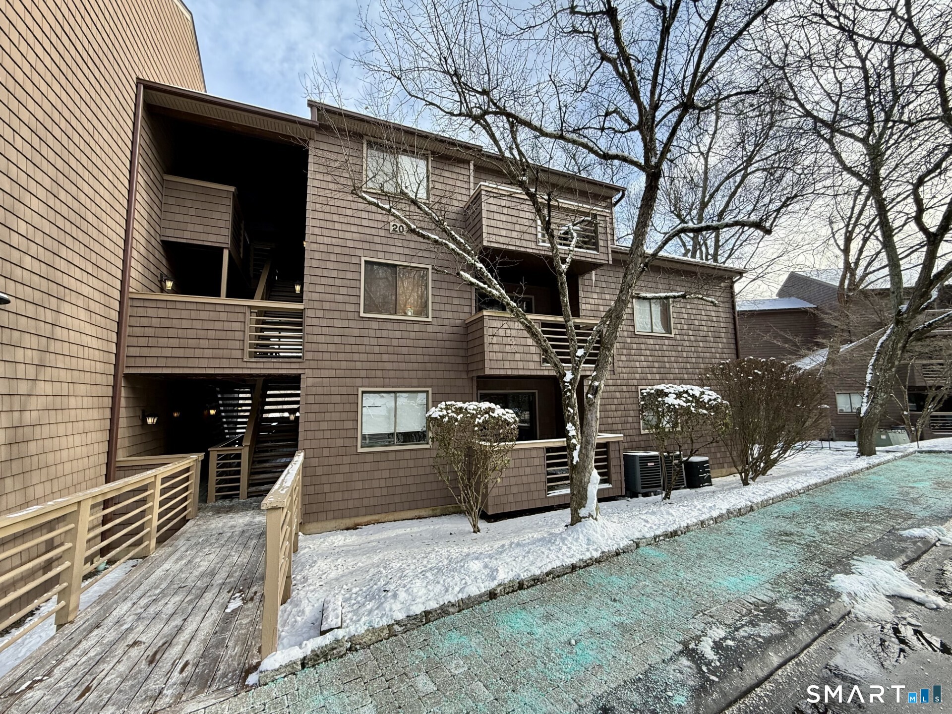 a front view of a house with parking