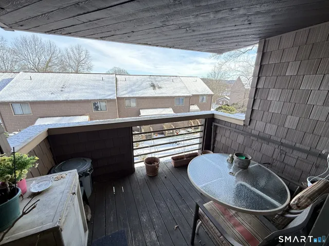 a kitchen with a sink a table and chairs