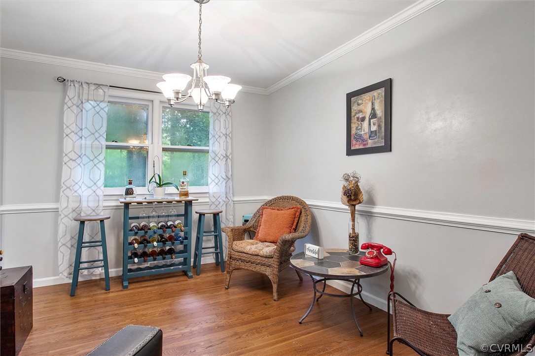 12808 Middlebrook Road Chester, VA 23831 - Photo 13 of 35 a living room with furniture and a chandelier