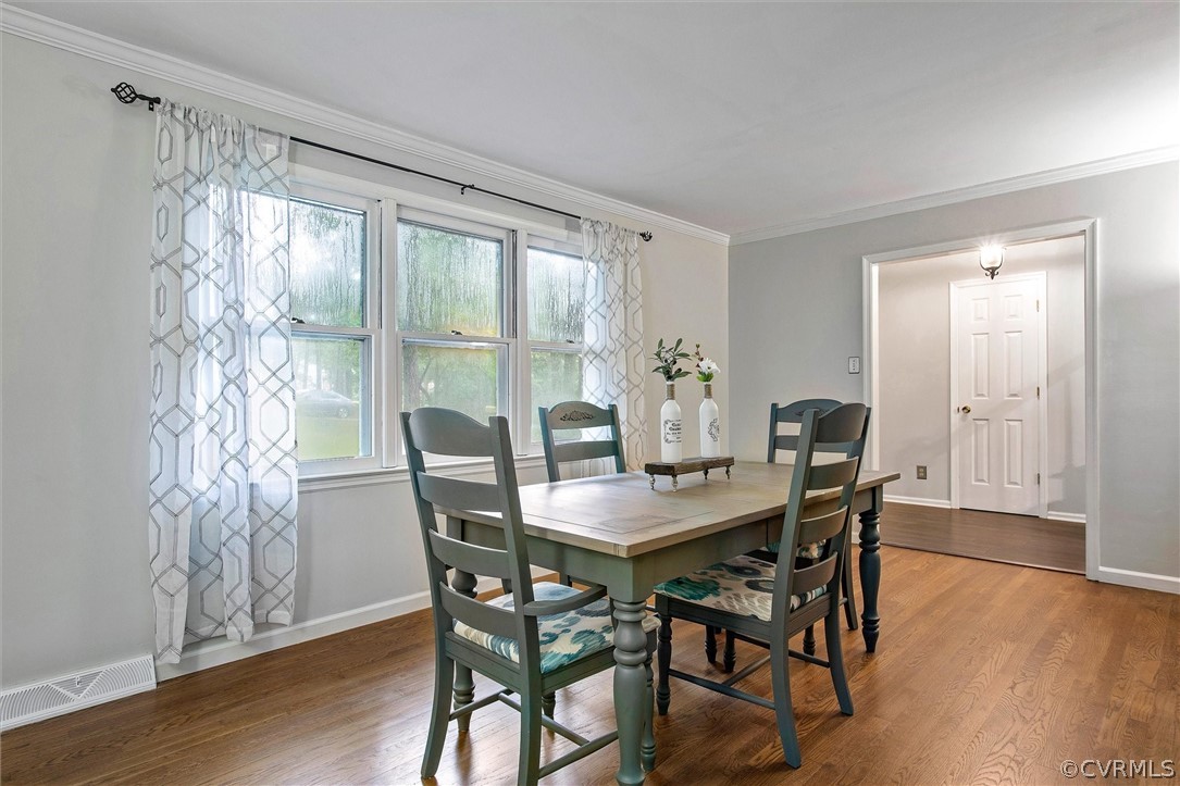 12808 Middlebrook Road Chester, VA 23831 - Photo 14 of 35 a view of a dining room with furniture window and wooden floor