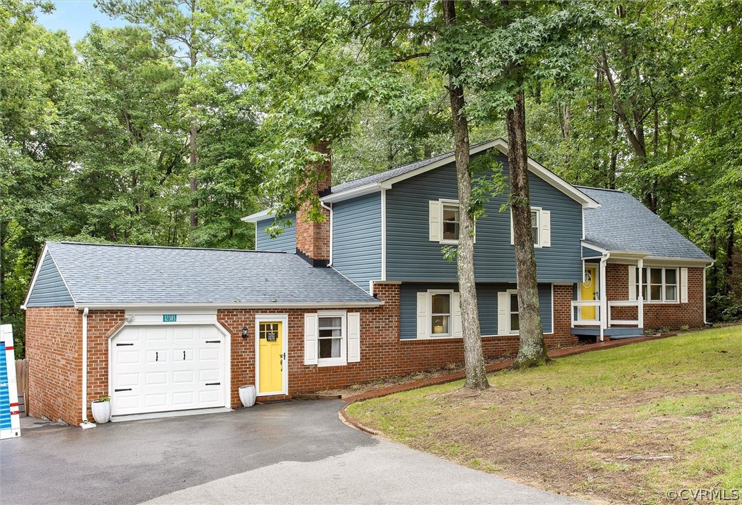 12808 Middlebrook Road Chester, VA 23831 - Photo 2 of 35 a front view of a house with a yard
