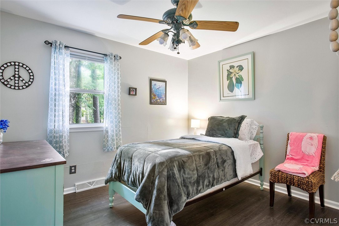 12808 Middlebrook Road Chester, VA 23831 - Photo 29 of 35 a bedroom with a bed and a table in it