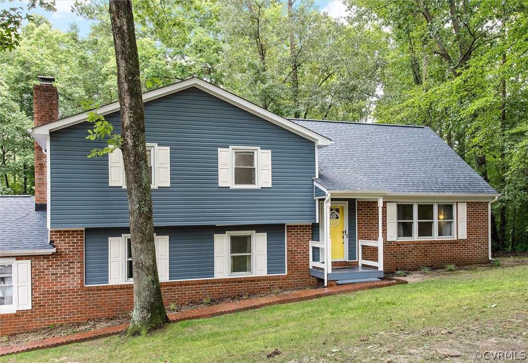 12808 Middlebrook Road Chester, VA 23831 - Photo 3 of 35 a backyard of a house with yard table and chairs
