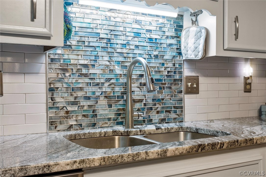 12808 Middlebrook Road Chester, VA 23831 - Photo 10 of 35 a bathroom with a granite countertop sink and a mirror
