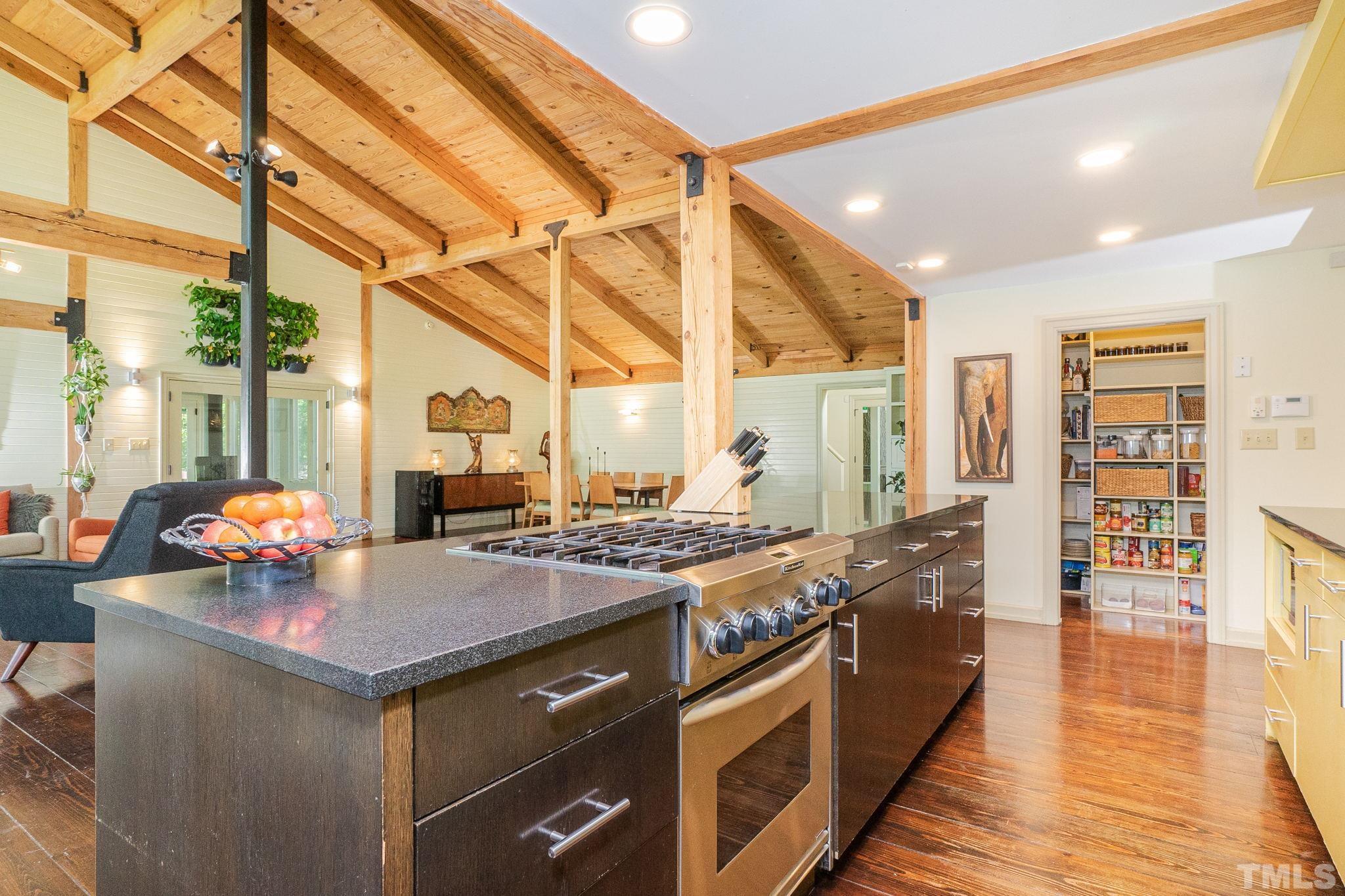 5215 Friends School Road Durham, NC 27705 - Photo 13 of 39 a kitchen with a stove and a wooden floors