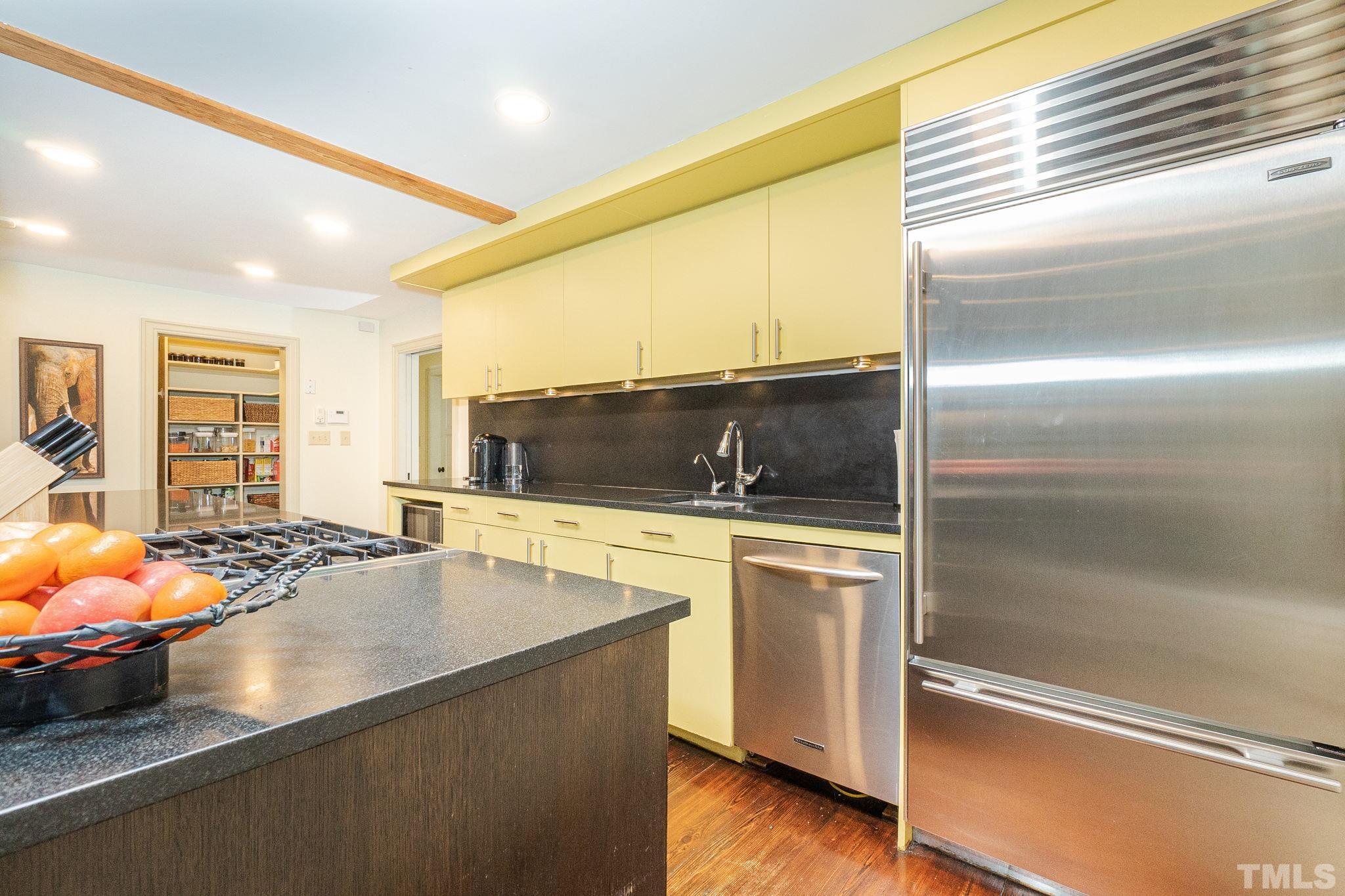 5215 Friends School Road Durham, NC 27705 - Photo 15 of 39 a kitchen with stainless steel appliances granite countertop a sink and a refrigerator