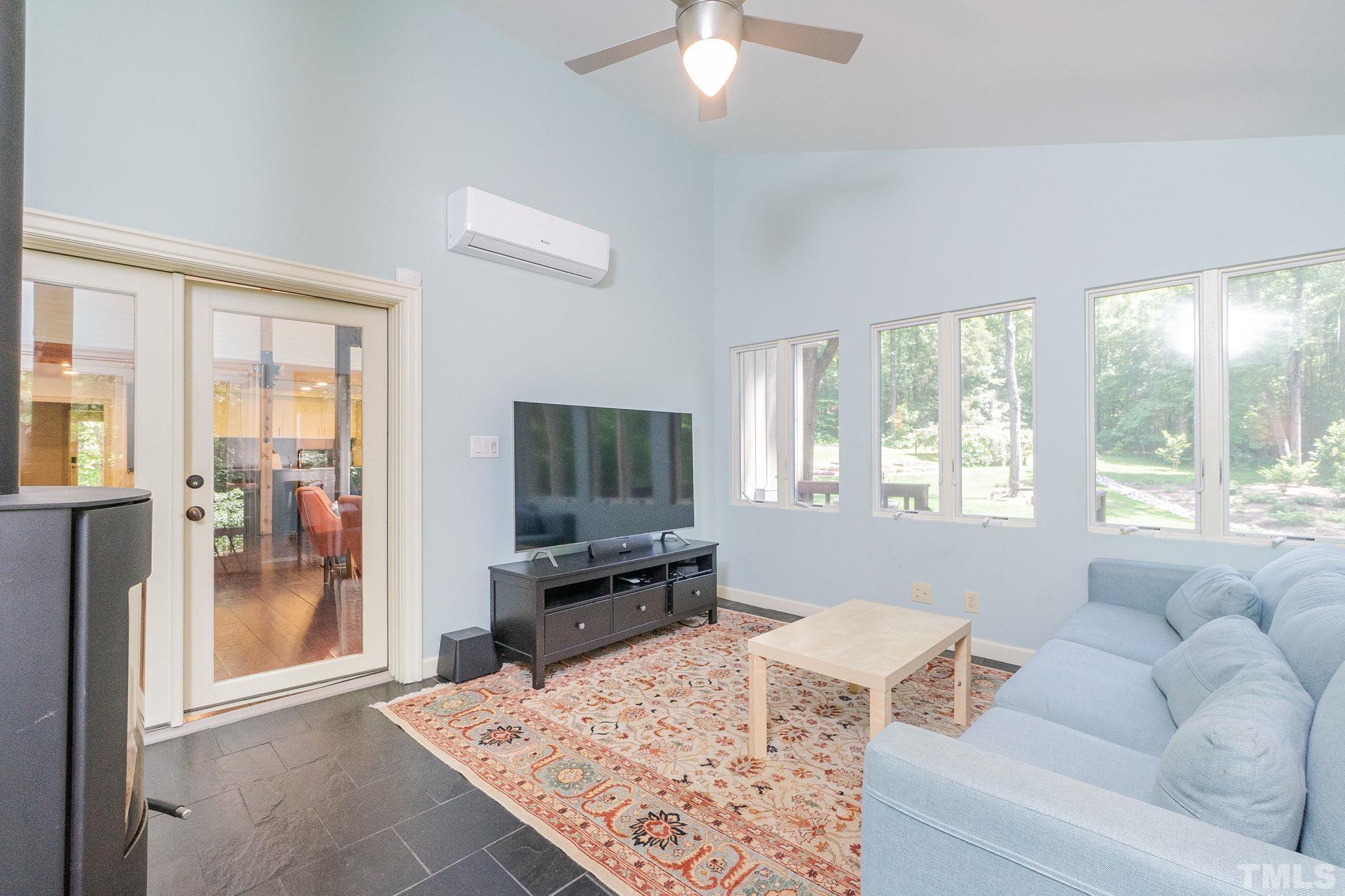 5215 Friends School Road Durham, NC 27705 - Photo 16 of 39 a living room with furniture and a flat screen tv