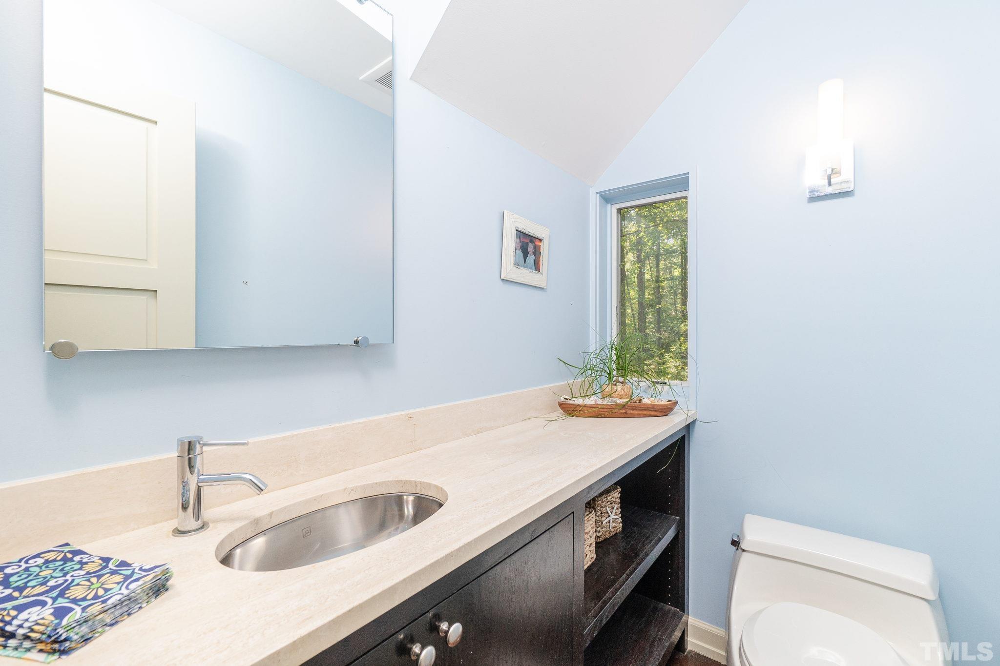 5215 Friends School Road Durham, NC 27705 - Photo 18 of 39 a bathroom with a sink and a toilet