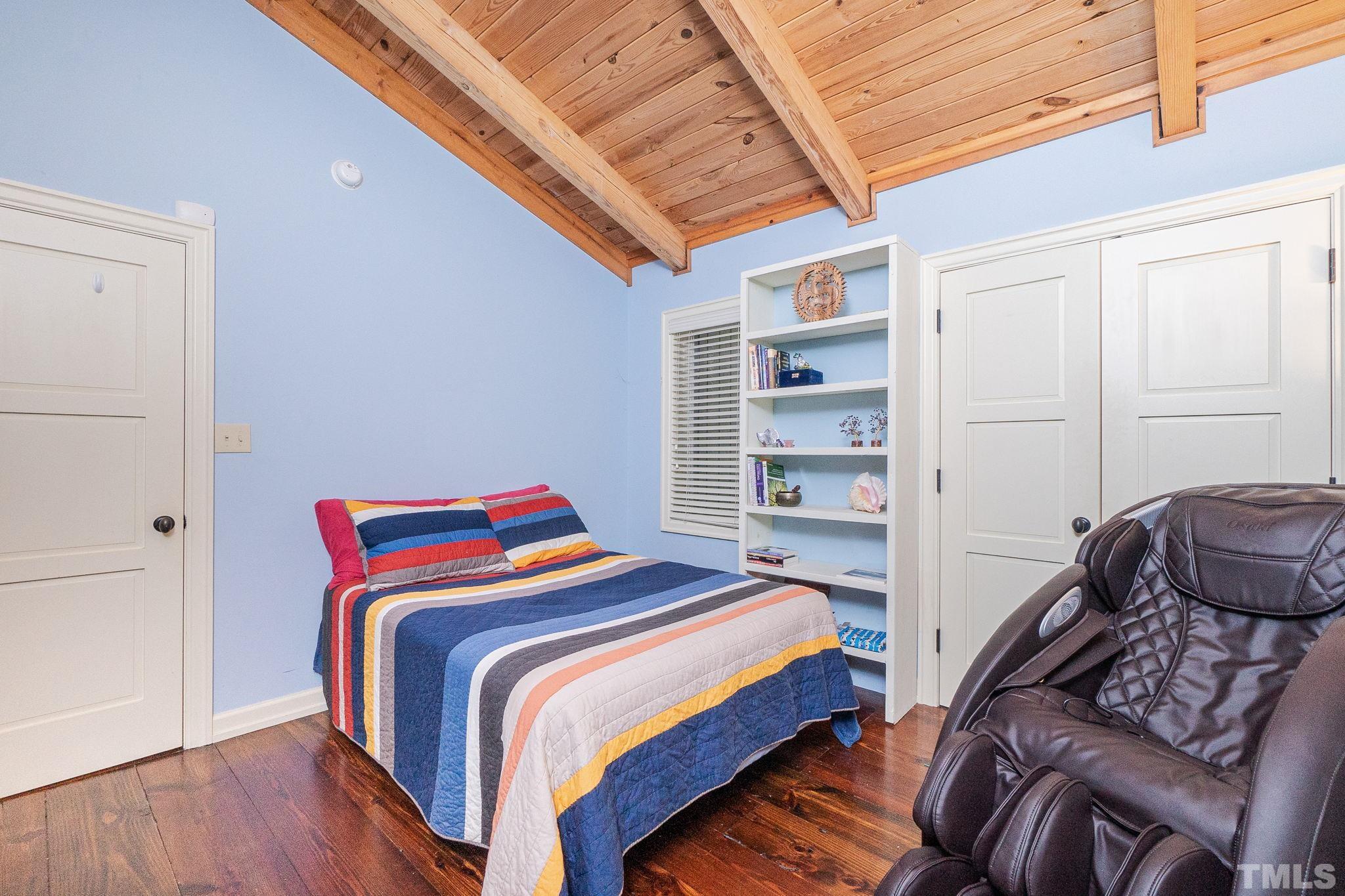 5215 Friends School Road Durham, NC 27705 - Photo 22 of 39 a bedroom with a bed and a closet