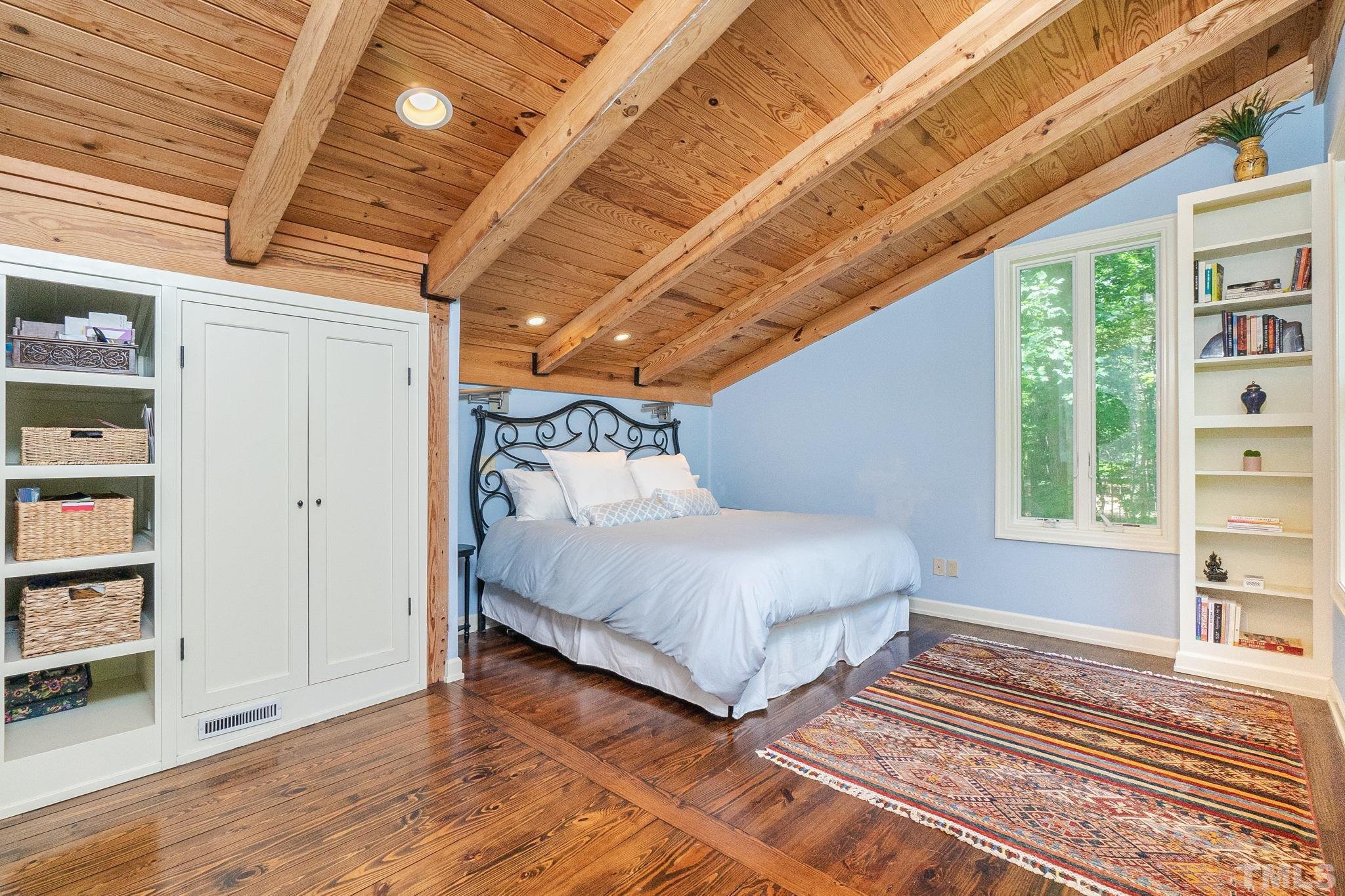 5215 Friends School Road Durham, NC 27705 - Photo 27 of 39 a spacious bedroom with a bed and a window