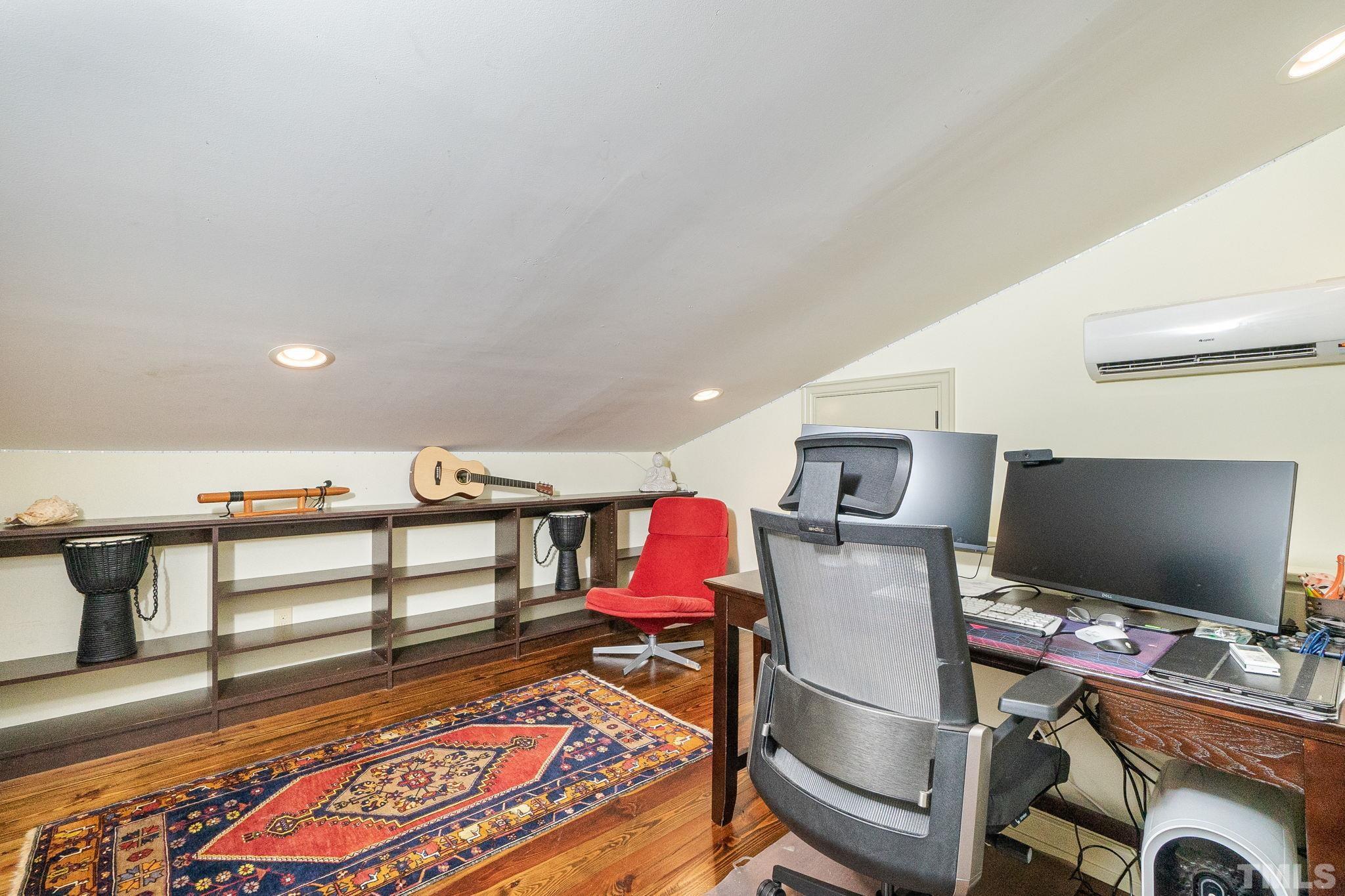 5215 Friends School Road Durham, NC 27705 - Photo 31 of 39 a living room with furniture a flat screen tv and a rug