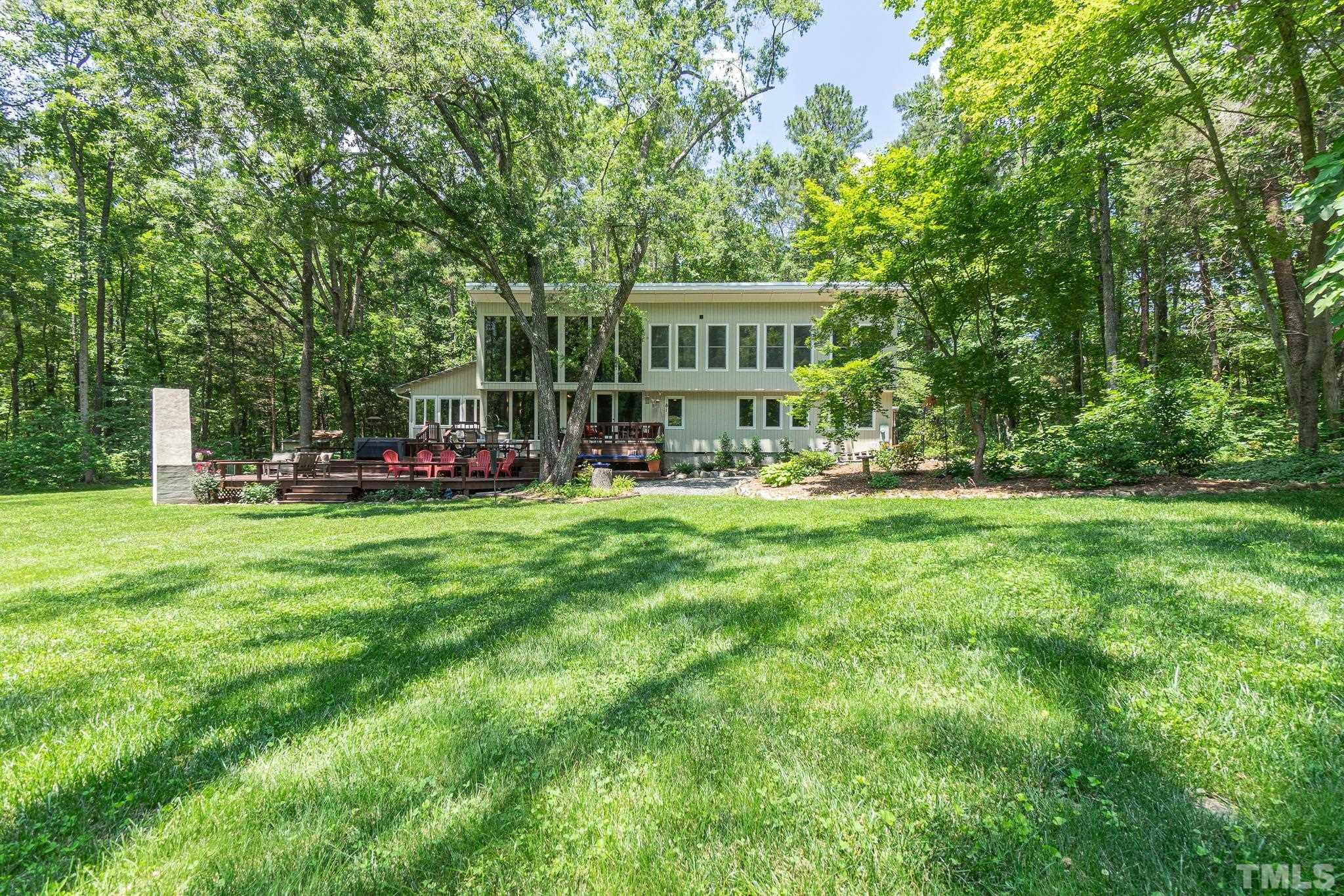 5215 Friends School Road Durham, NC 27705 - Photo 32 of 39 a view of a house with a yard porch and sitting area