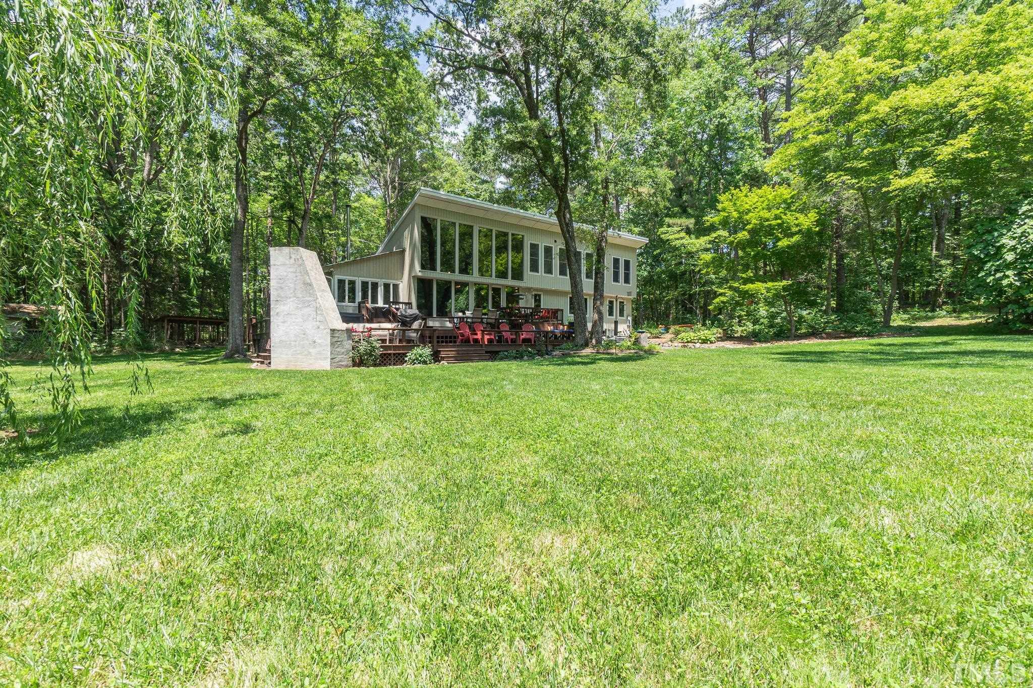 5215 Friends School Road Durham, NC 27705 - Photo 33 of 39 a view of a house with backyard and porch