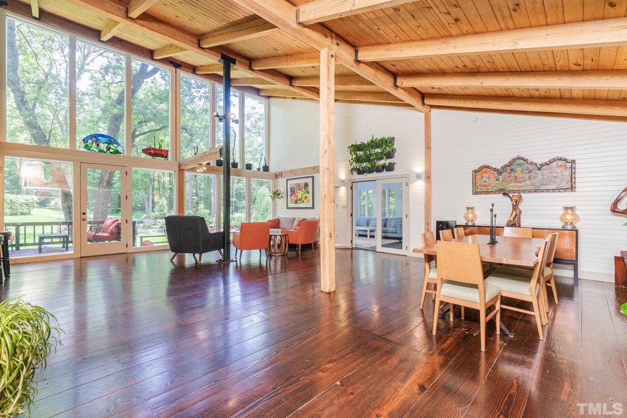 5215 Friends School Road Durham, NC 27705 - Photo 7 of 39 a dining room with wooden floor a chandelier
