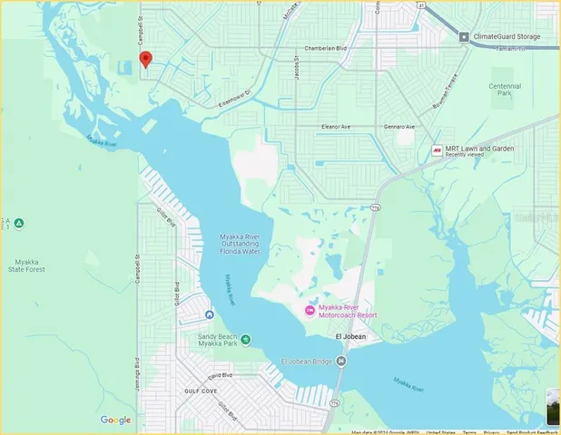 a white vase with flowers on it