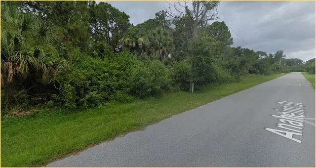 a view of a lake with a big yard