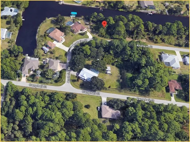 an aerial view of waterside residential houses with outdoor space