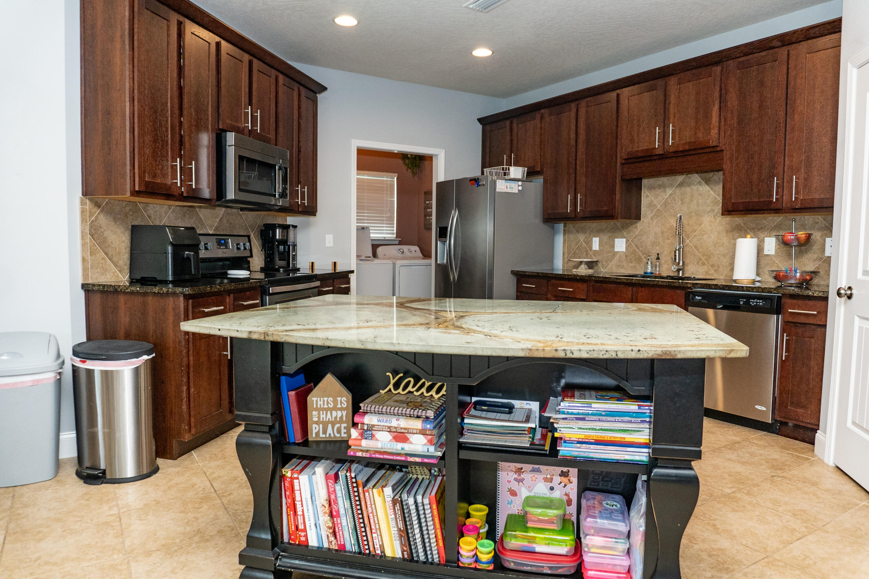 4517 Beth Circle Crestview, FL 32539 - Photo 11 of 45 a kitchen with stainless steel appliances a stove a sink dishwasher and cabinets