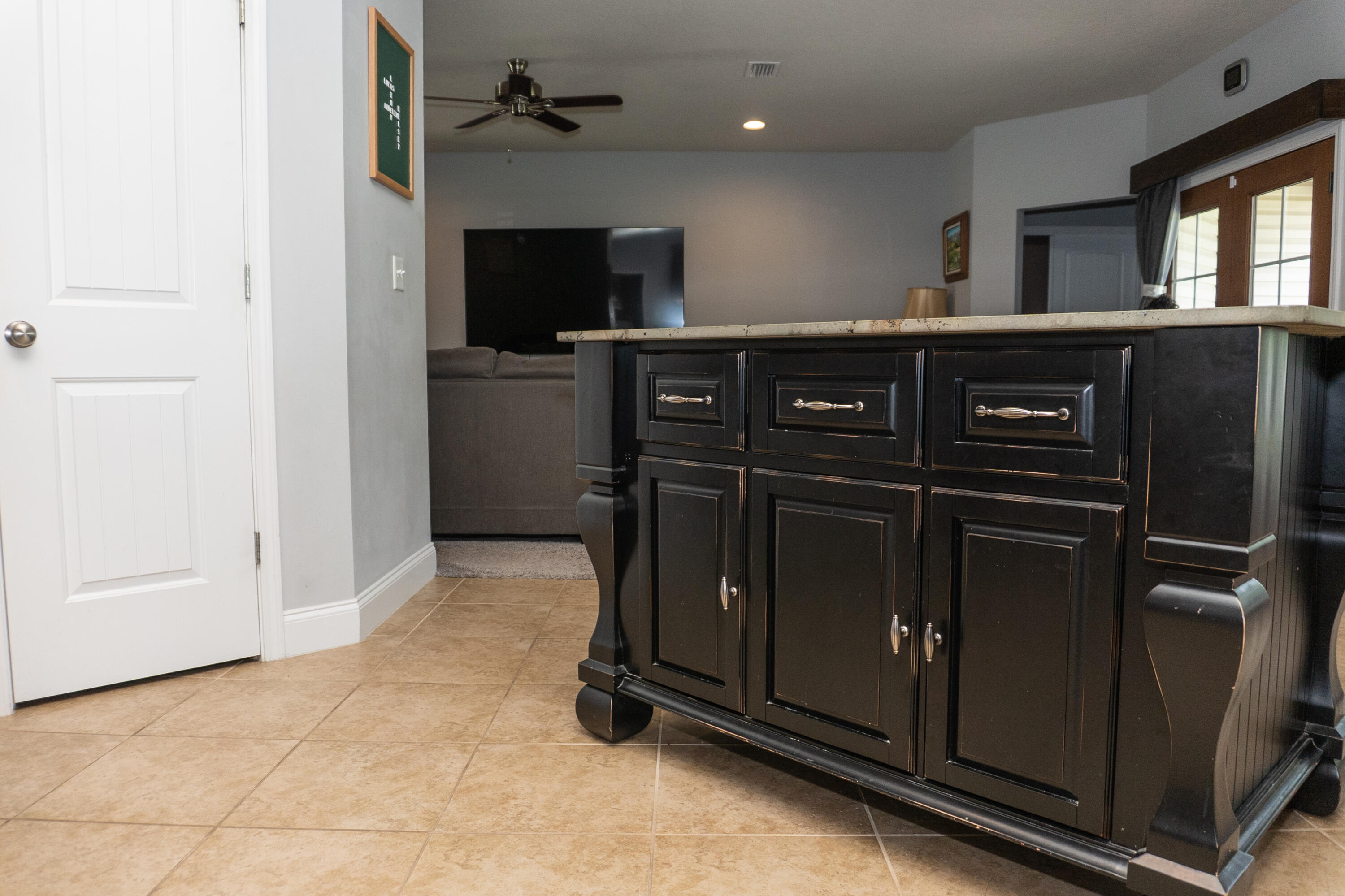 4517 Beth Circle Crestview, FL 32539 - Photo 14 of 45 a kitchen with a refrigerator and a sink