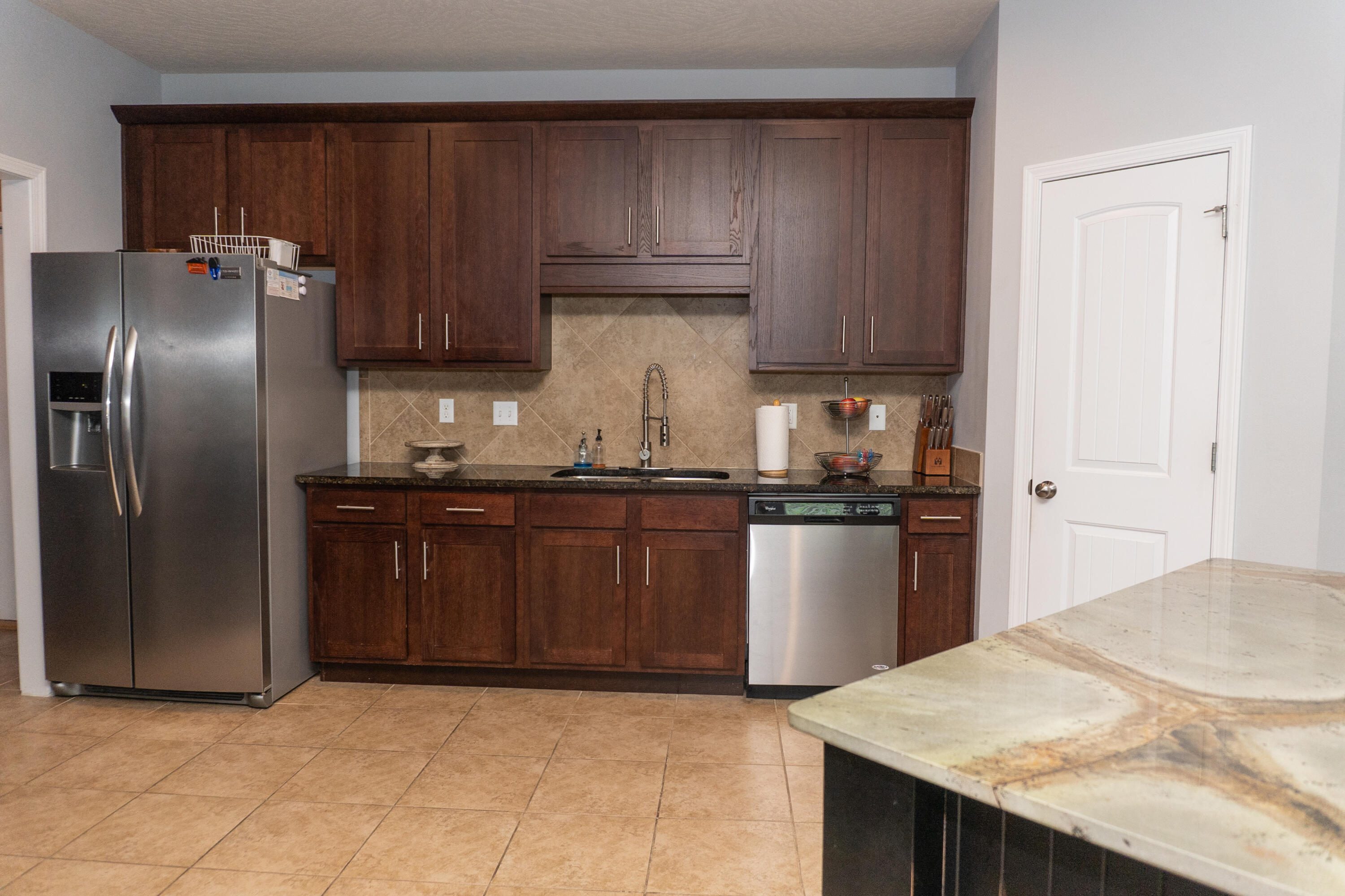 4517 Beth Circle Crestview, FL 32539 - Photo 16 of 45 a kitchen with a refrigerator sink and cabinets
