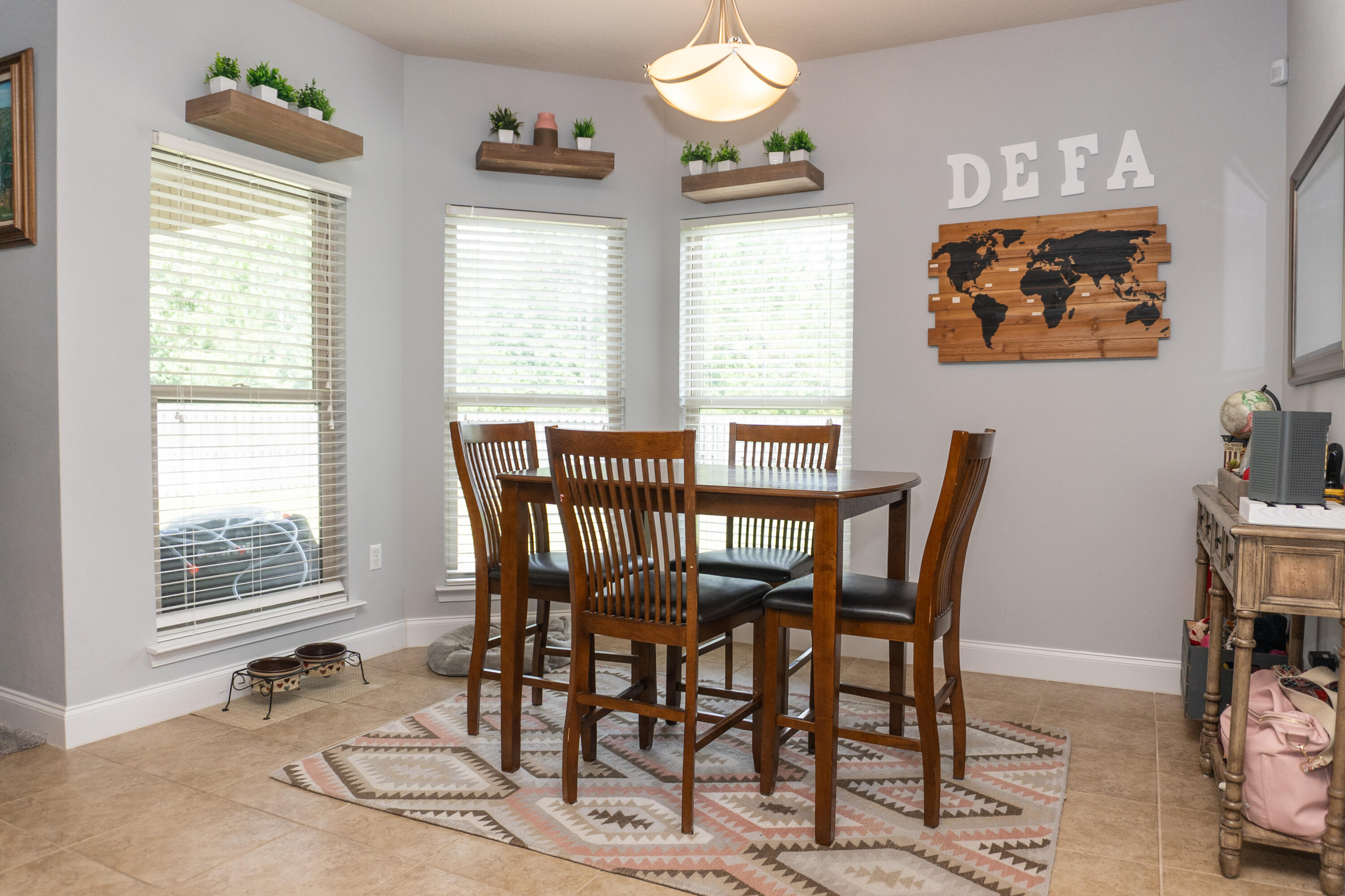 4517 Beth Circle Crestview, FL 32539 - Photo 17 of 45 a view of a dining room with furniture a chandelier and a window