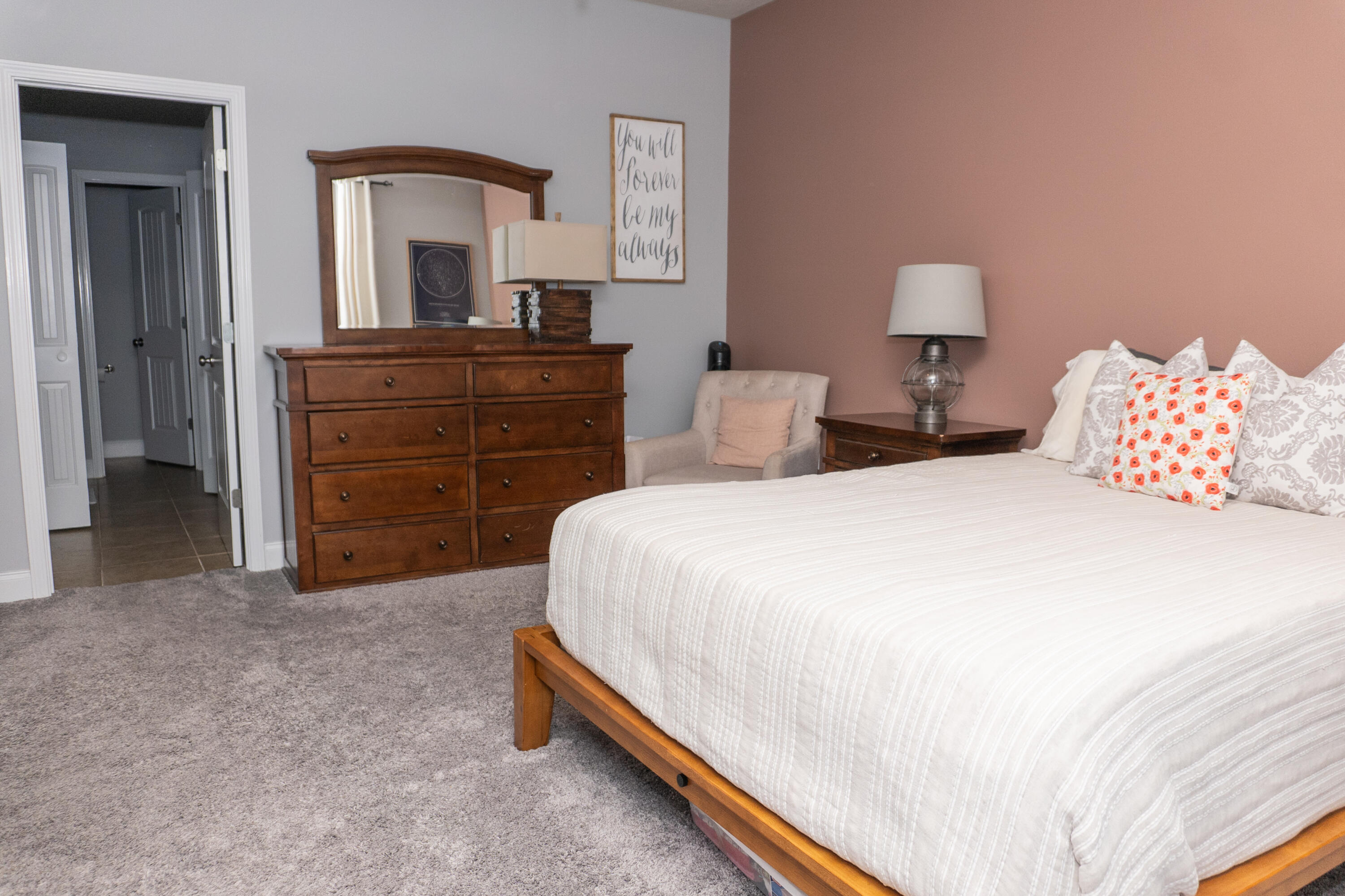 4517 Beth Circle Crestview, FL 32539 - Photo 19 of 45 a spacious bedroom with a bed and a dresser