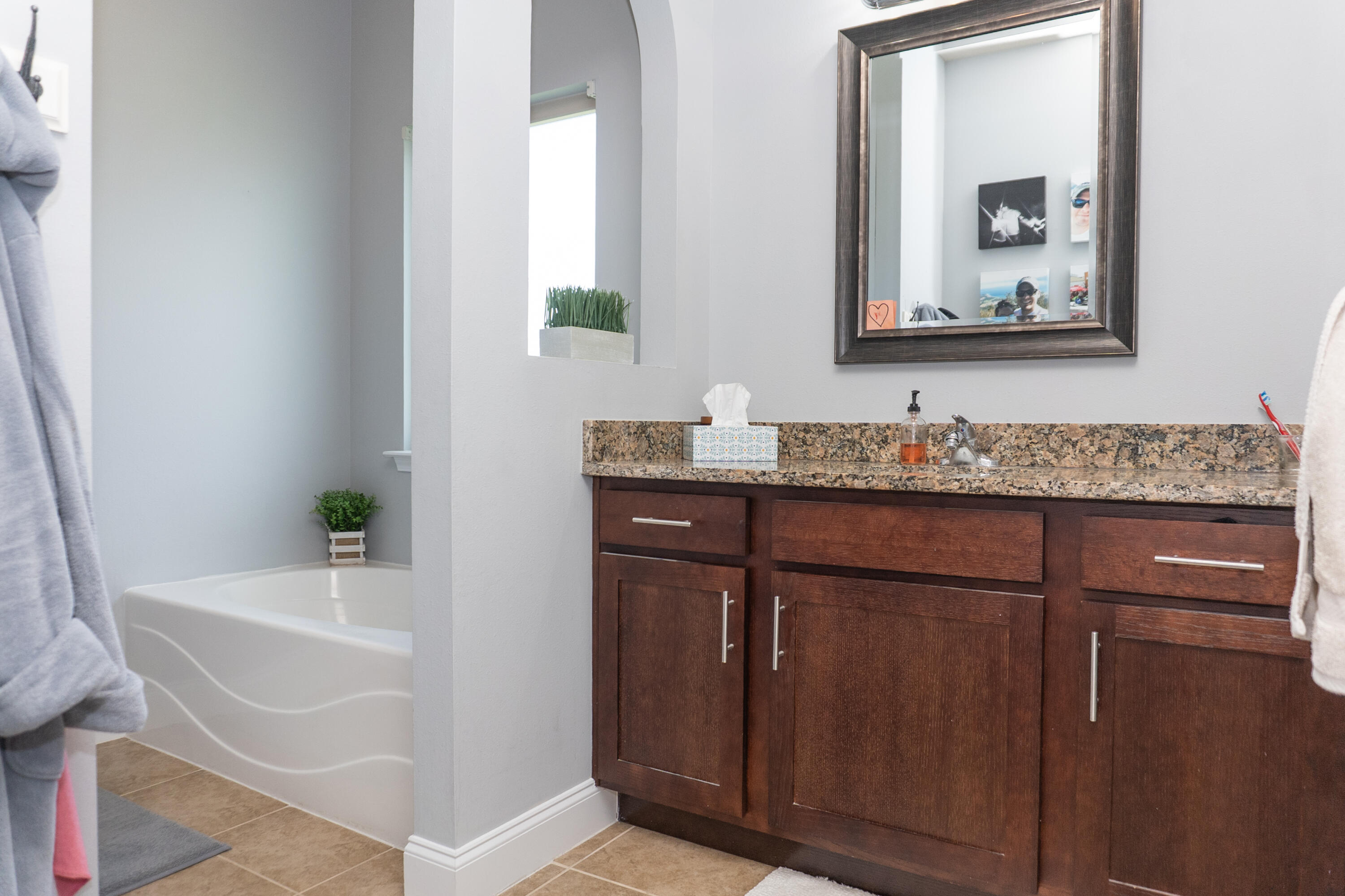 4517 Beth Circle Crestview, FL 32539 - Photo 22 of 45 a bathroom with a sink and a mirror