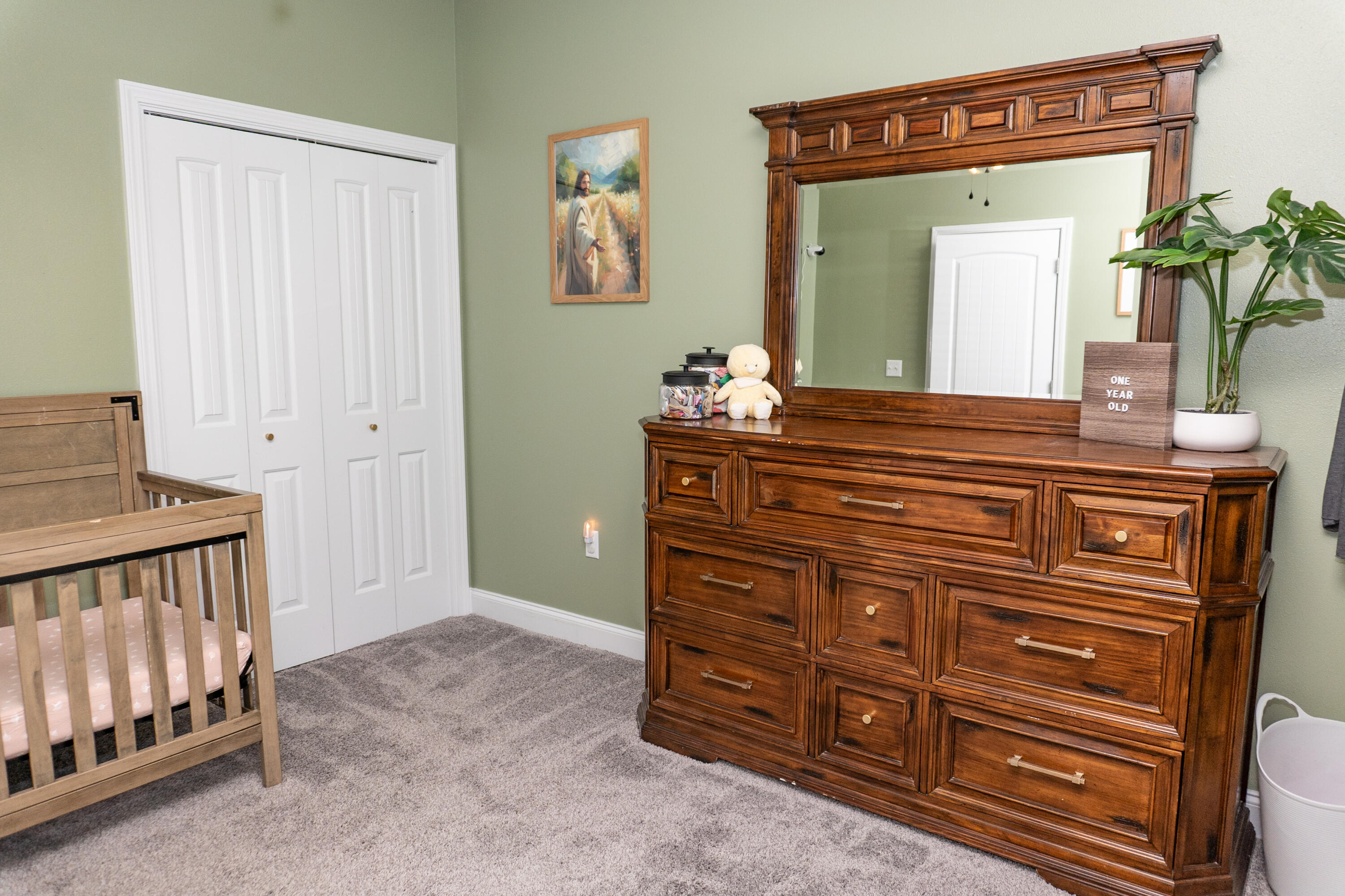 4517 Beth Circle Crestview, FL 32539 - Photo 28 of 45 a spacious bedroom with a dresser and a mirror