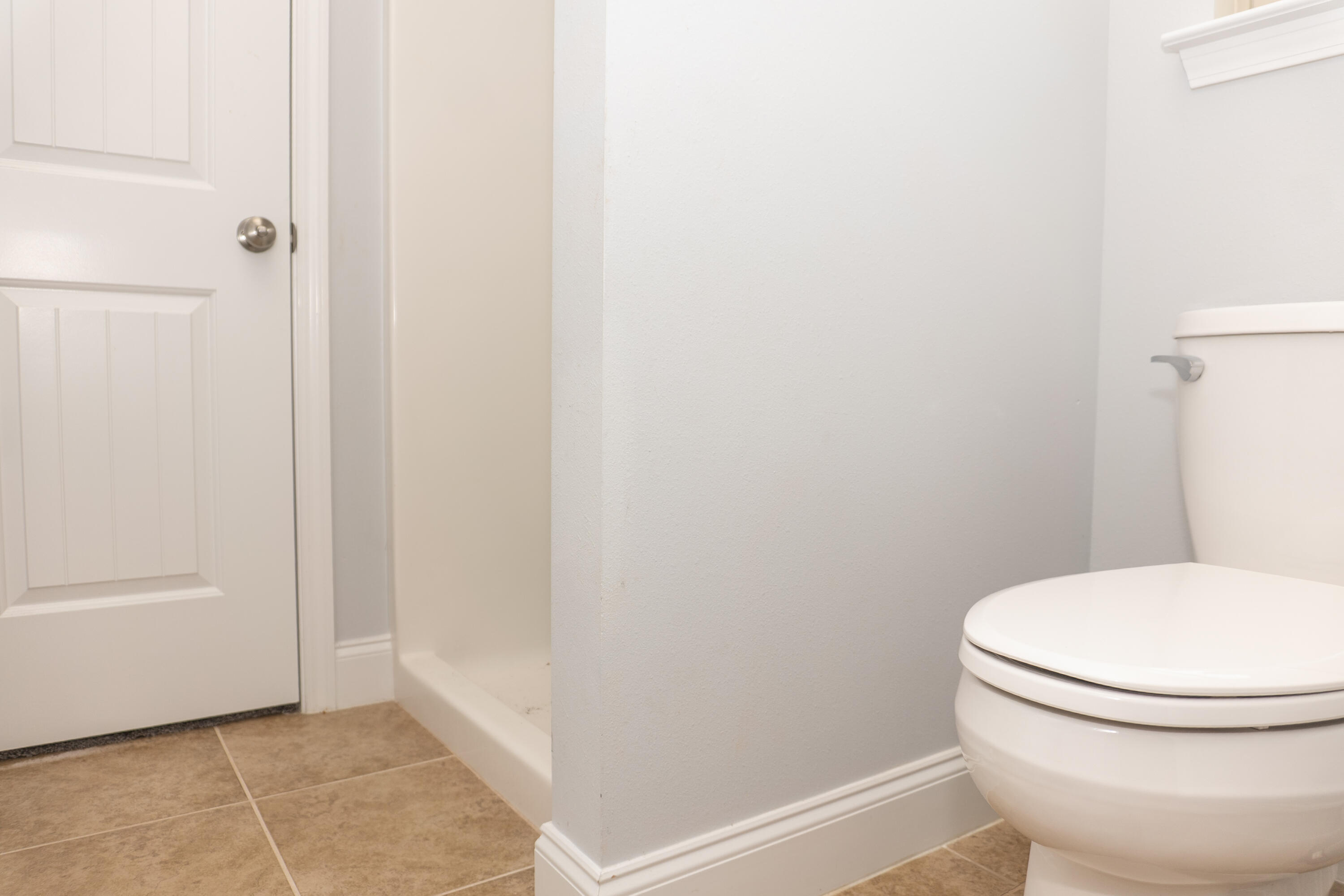 4517 Beth Circle Crestview, FL 32539 - Photo 38 of 45 a white toilet sitting next to a bathroom