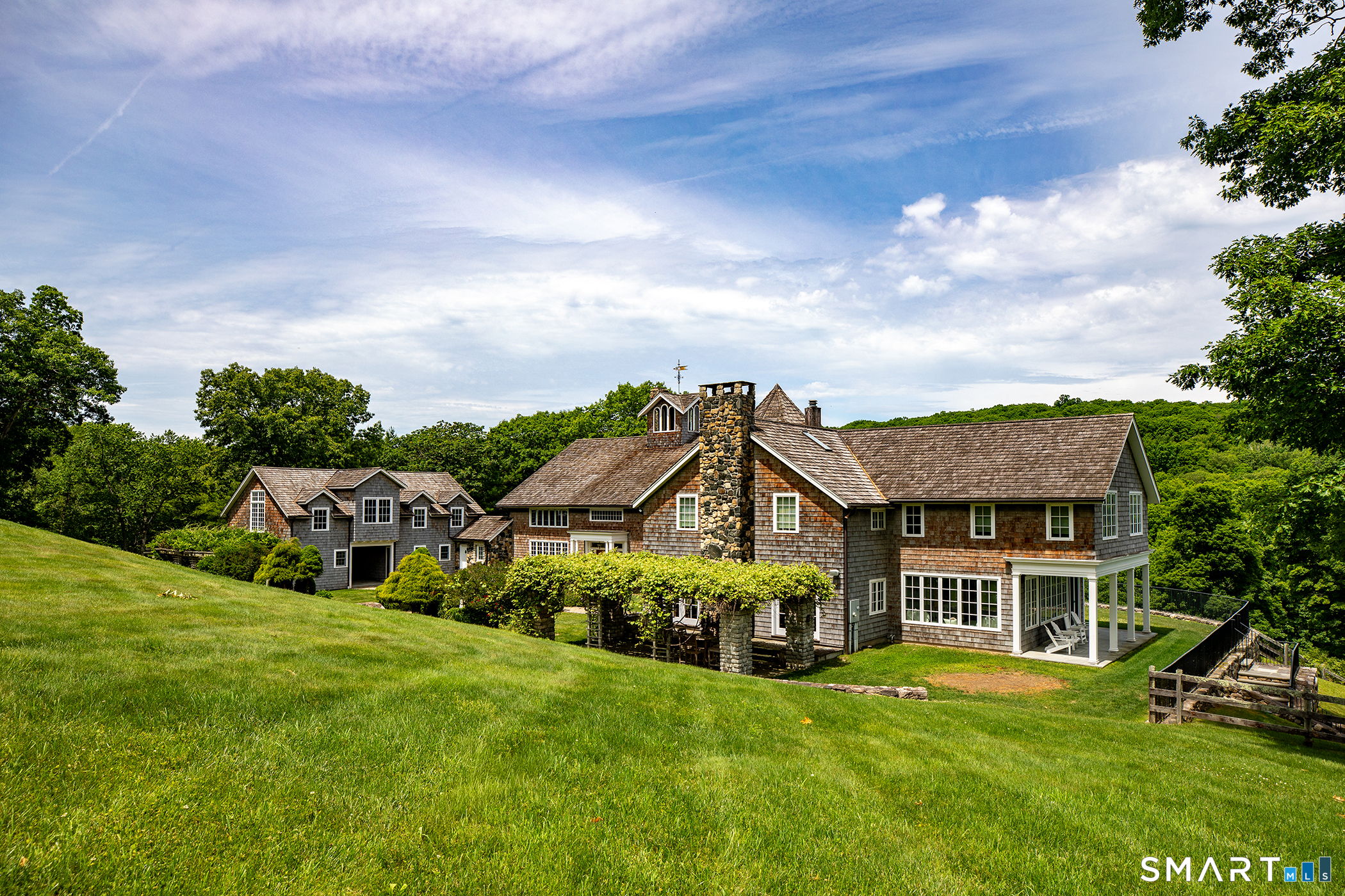 56 West Morris Road Washington, CT 06794 - Photo 39 of 40 a view of a house with a big yard and large trees