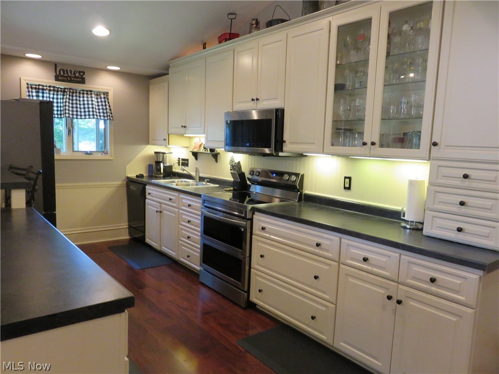 37416 Detroit Road Avon, OH 44011 - Photo 6 of 31 Kitchen with sink, new stainless steel appliances, and white cabinetry