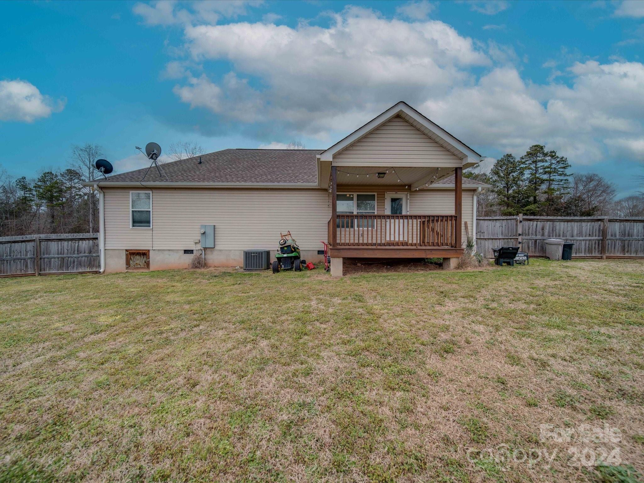 345 Springlake Road York, SC 29745 - Photo 2 of 17 a view of a house with wooden fence