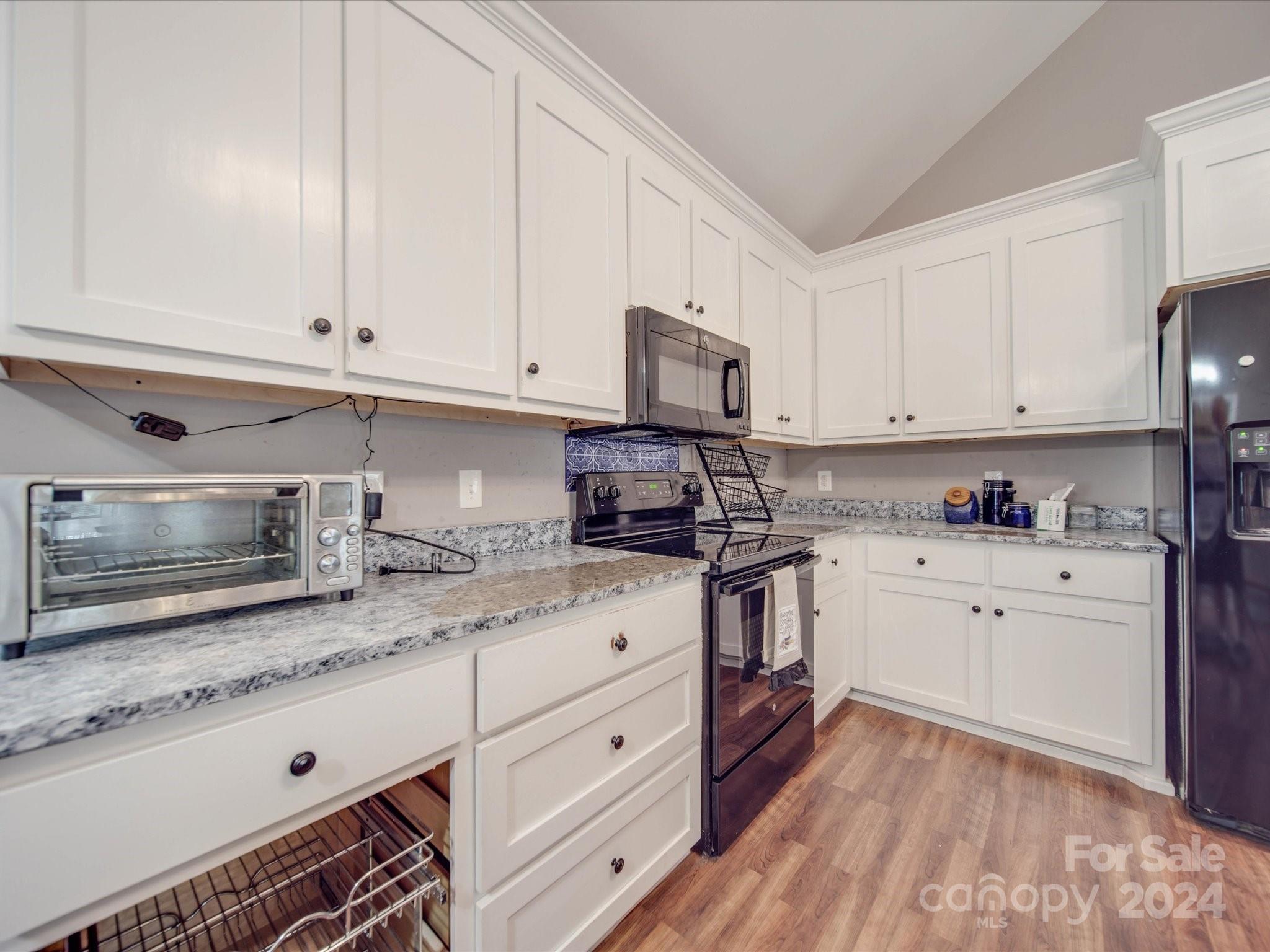 345 Springlake Road York, SC 29745 - Photo 7 of 17 a kitchen with granite countertop white cabinets white stainless steel appliances with a sink and dishwasher