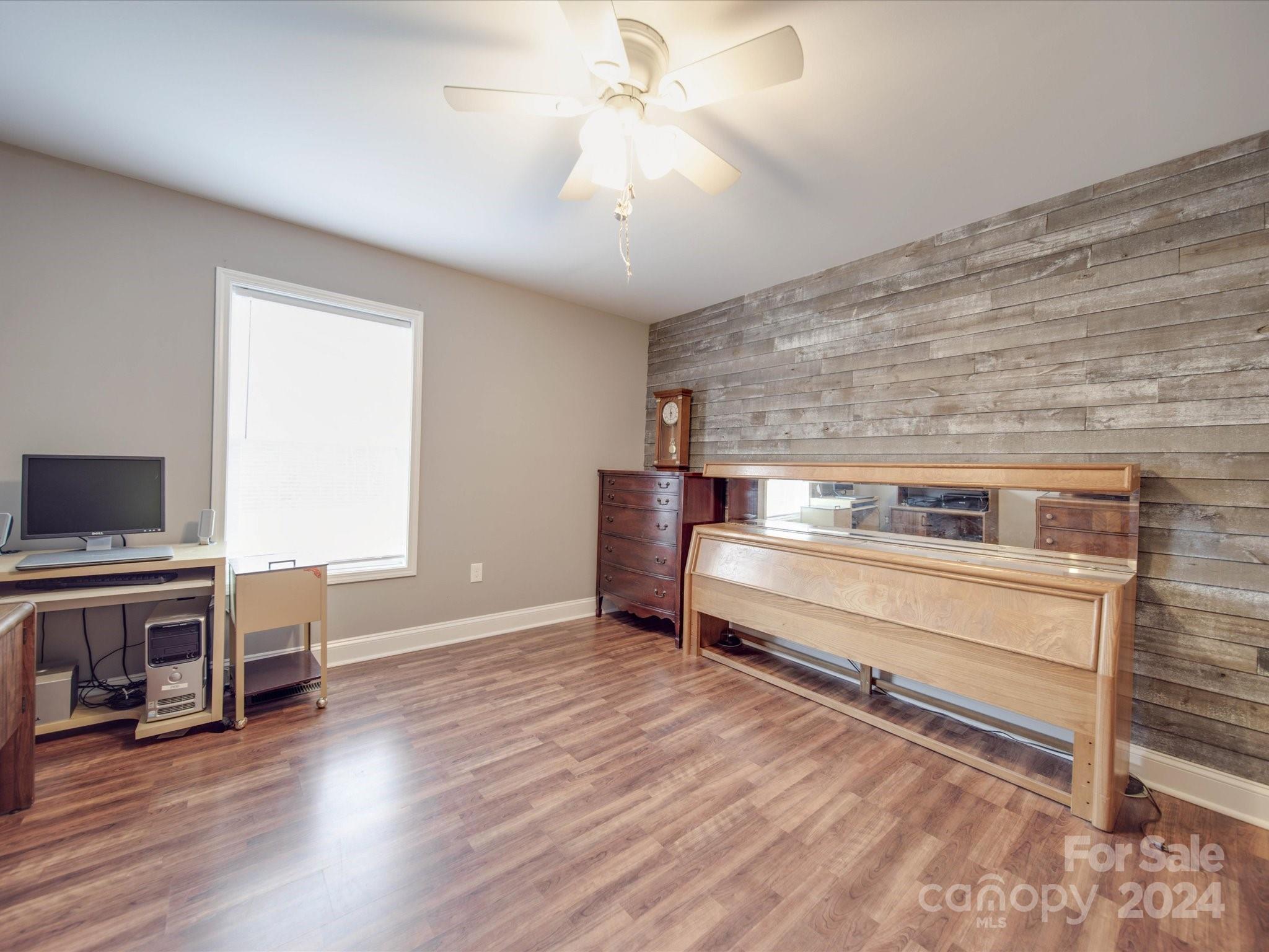 345 Springlake Road York, SC 29745 - Photo 9 of 17 a view of livingroom with hardwood floor and a ceiling fan