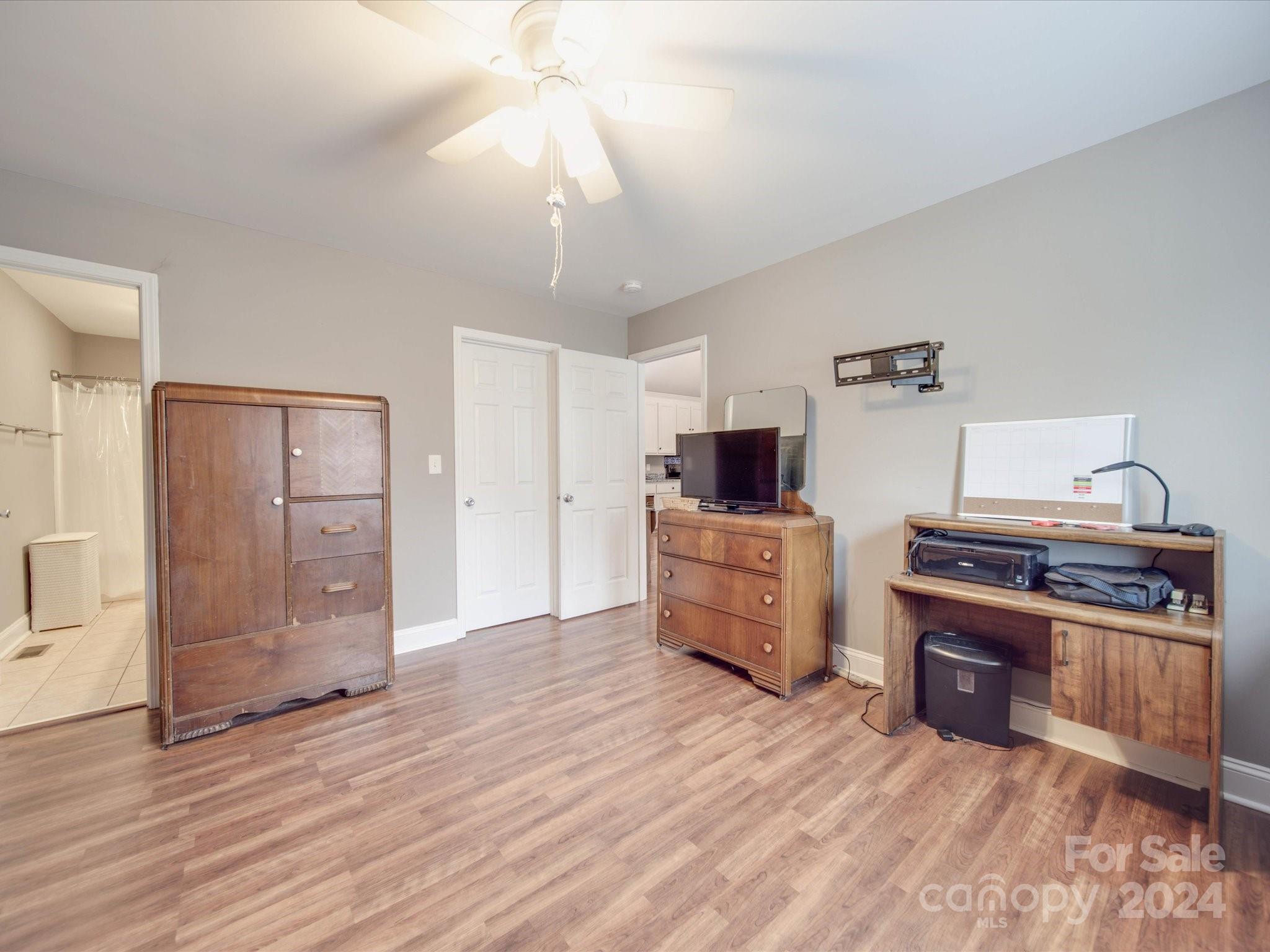 345 Springlake Road York, SC 29745 - Photo 10 of 17 a view of kitchen with stainless steel appliances granite countertop a stove top oven a refrigerator and cabinets with wooden floor
