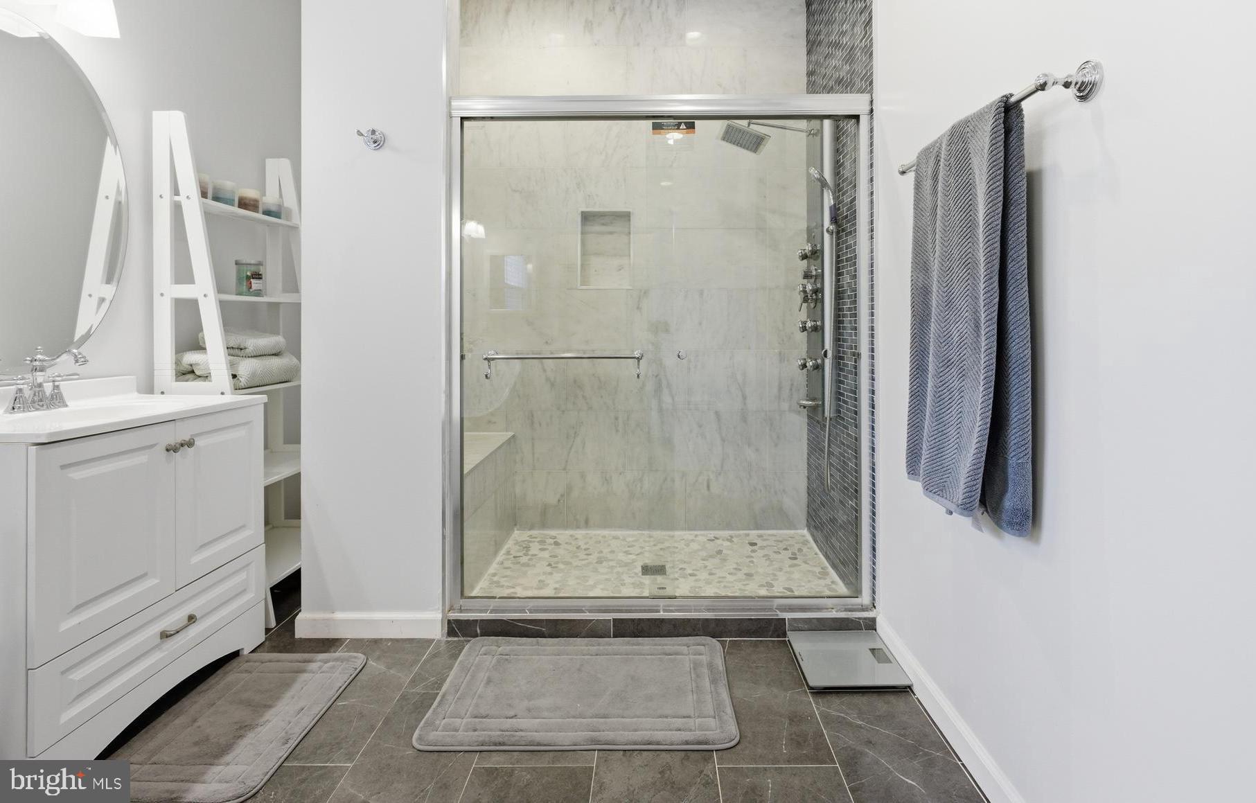 8664 Pohick Forest Court Springfield, VA 22153 - Photo 23 of 41 a bathroom with a shower and a sink