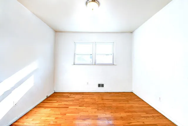 a view of an empty room and window