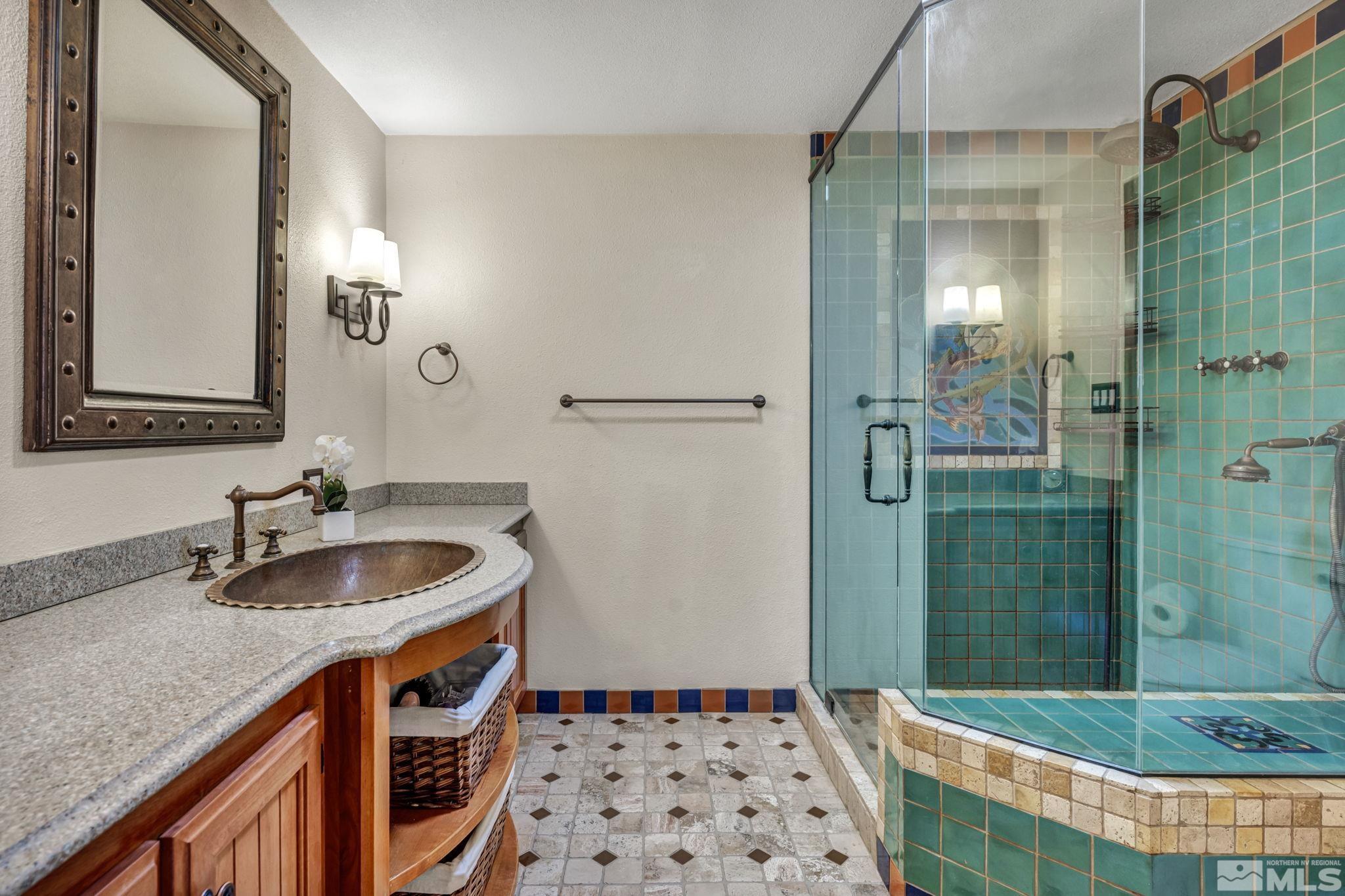 14230 Riata Circle Reno, NV 89521 - Photo 21 of 40 a bathroom with a sink and a mirror