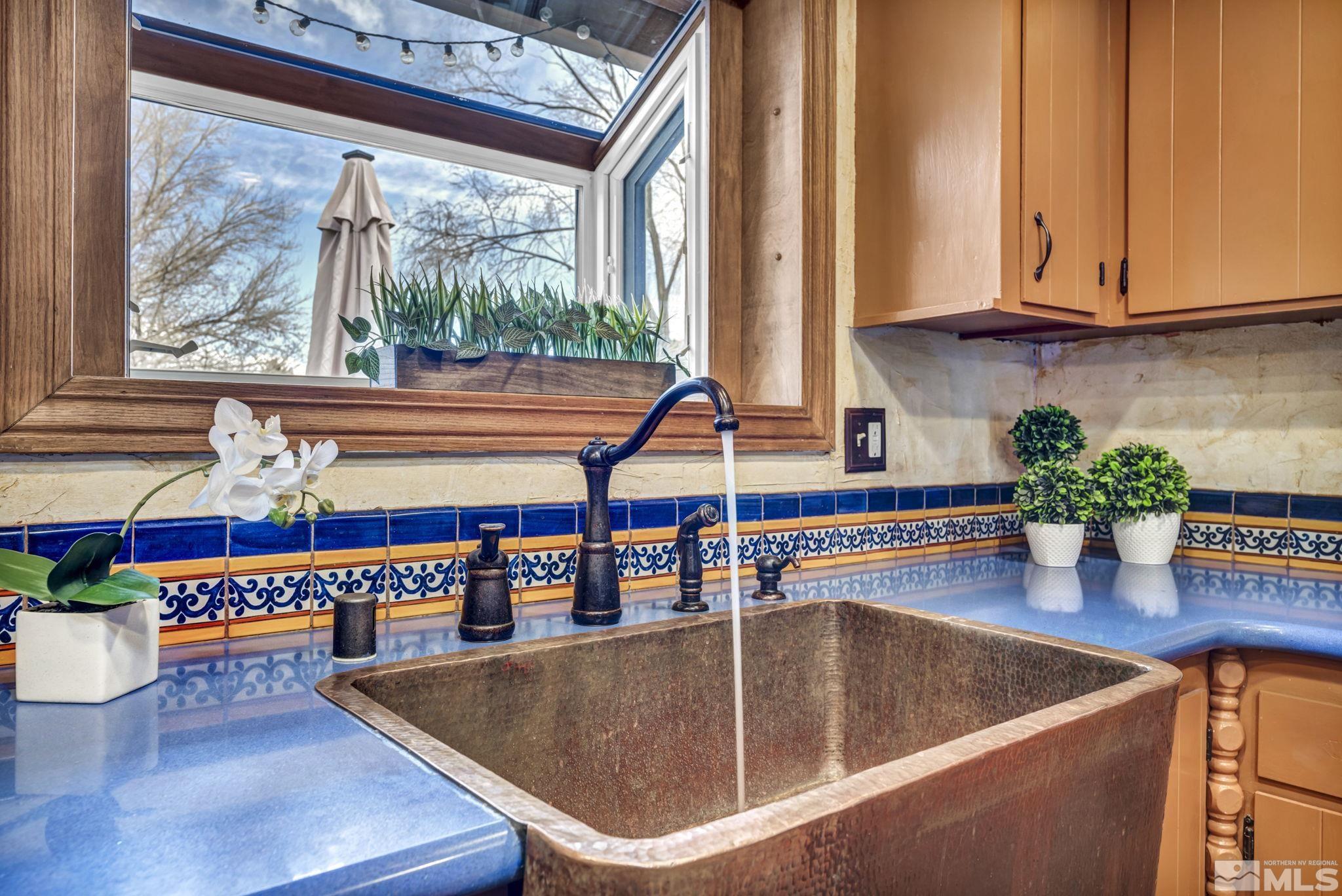 14230 Riata Circle Reno, NV 89521 - Photo 7 of 40 a room with wooden floor table and chairs
