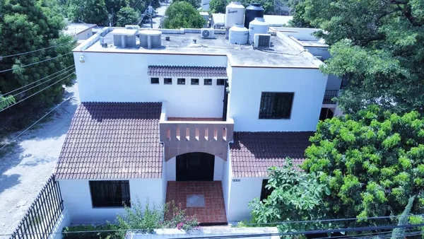 a front view of a house with yard and seating area