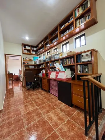 a bedroom with a large bed and a dresser