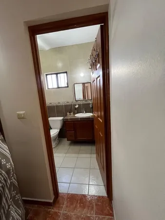 a bathroom with a sink and mirror