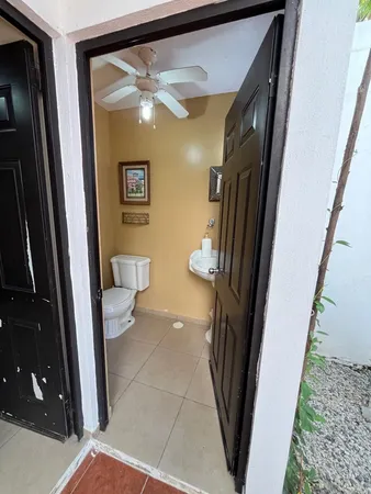 a view of a entryway door of the house and living room