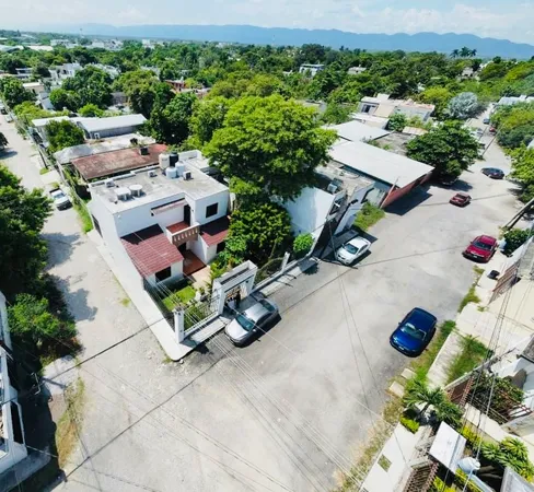 an aerial view of a house with yard