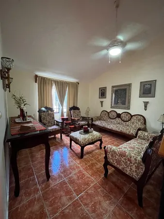 a living room with furniture and a window