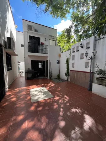 a large white bed in a white house